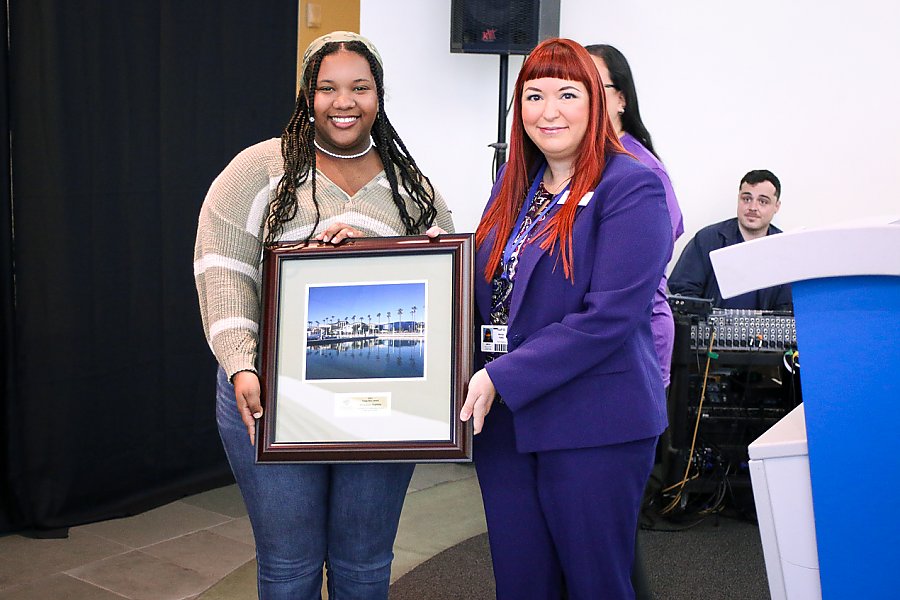 Two women holding award