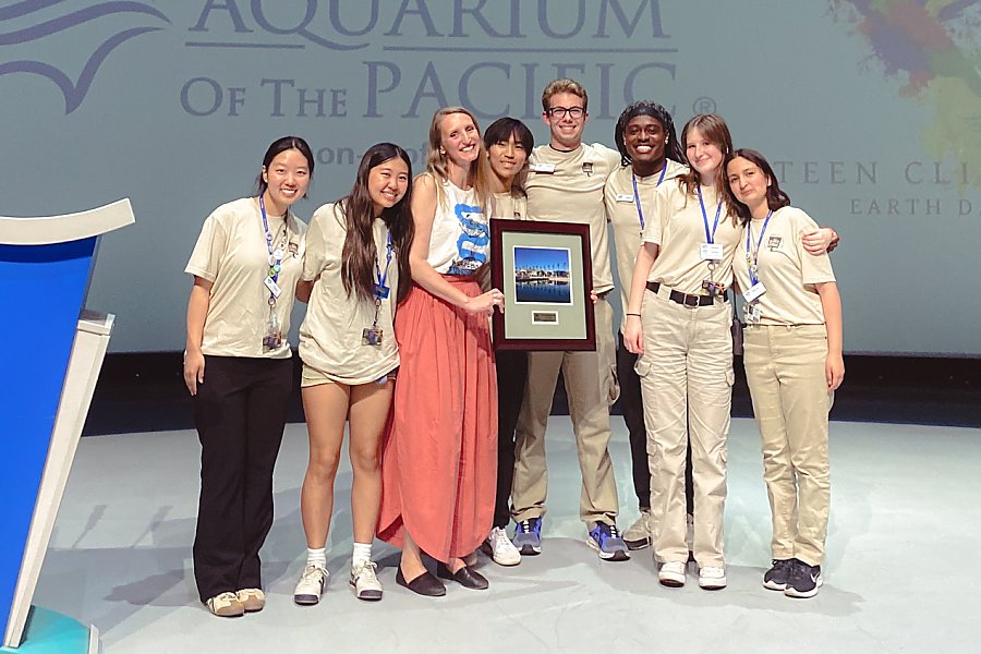 Group of people holding award